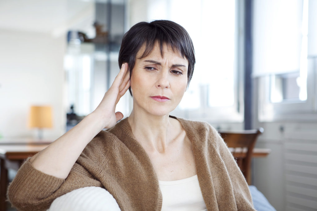 woman experiencing tinnitus